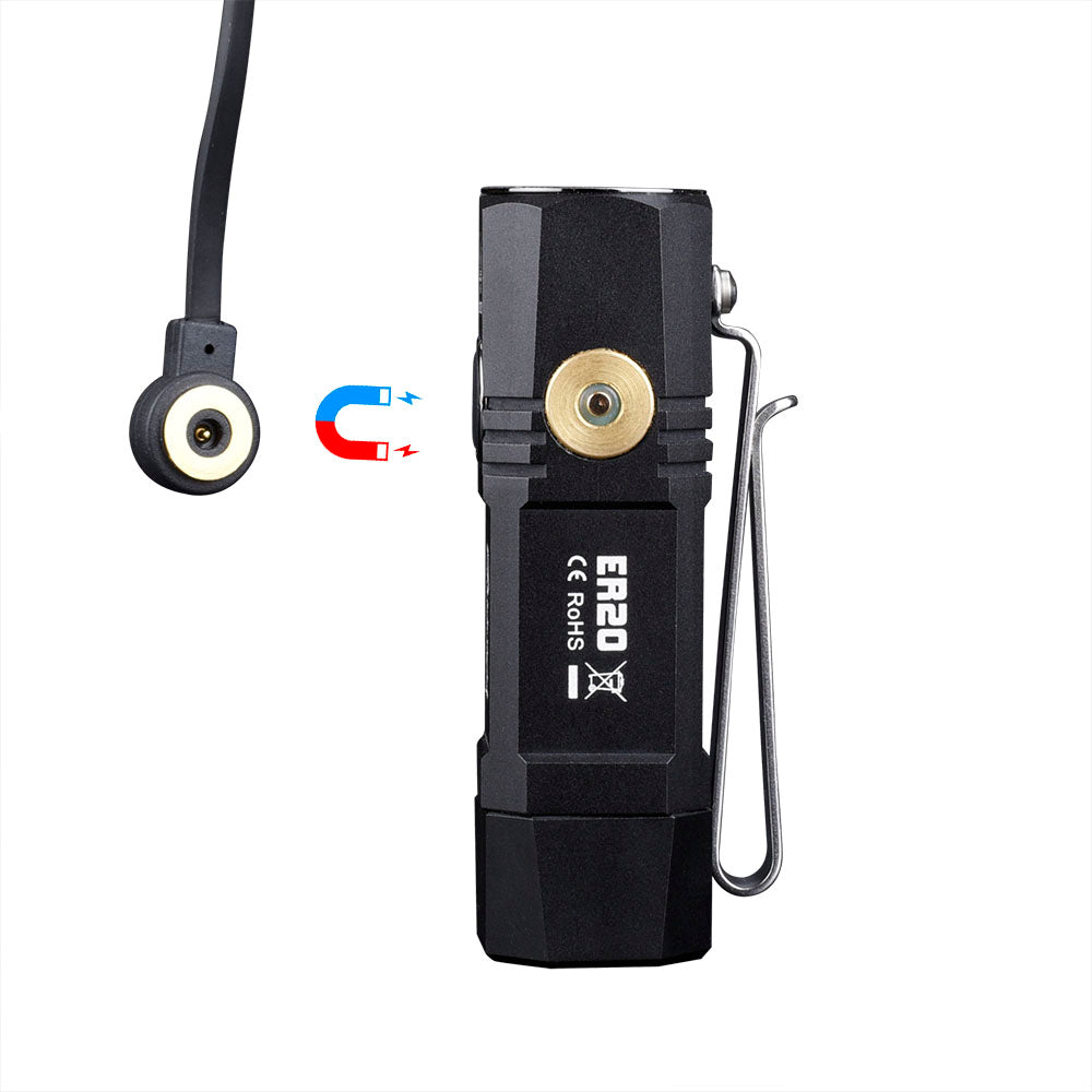 Fitorch ER20 black flashlight beside its round magnetic charging-cable connector