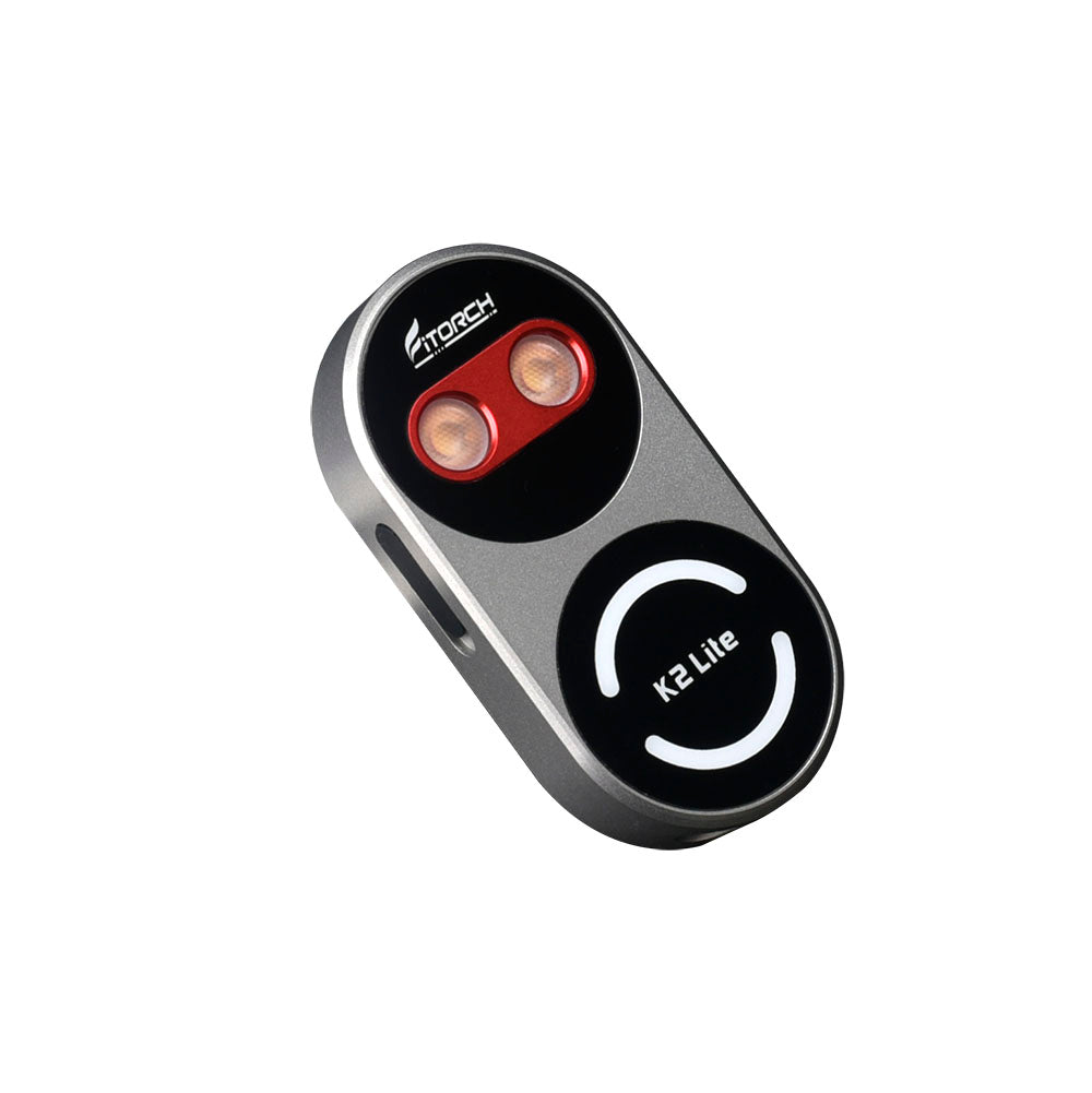 Fitorch K2 Lite gray keychain light angled to show its two main LEDs and circular front design