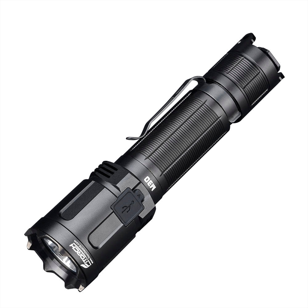 Fitorch M30 black tactical flashlight angled to show the pocket clip and charging-port cover