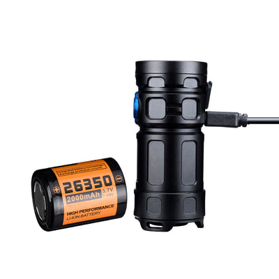 Fitorch P25GT flashlight connected to a USB-C cable beside a 26350 battery