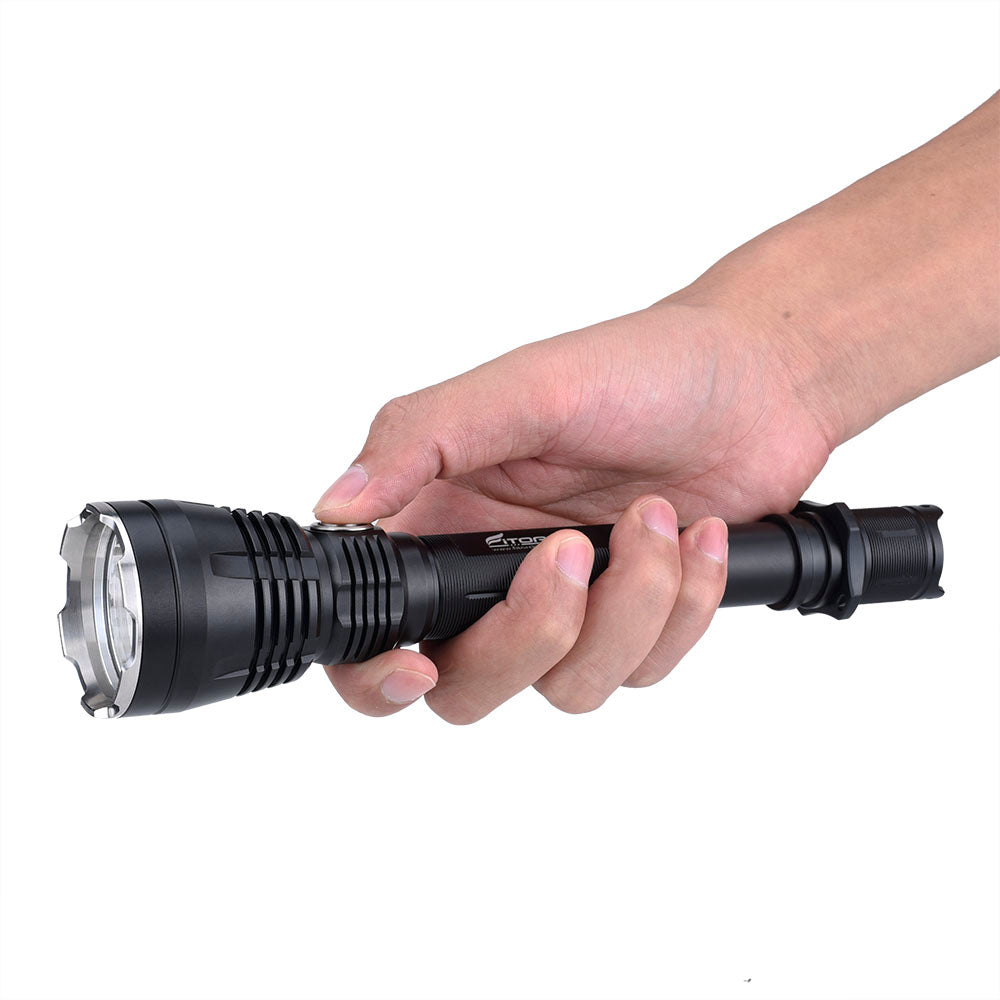 Fitorch PR40 long black flashlight held in one hand